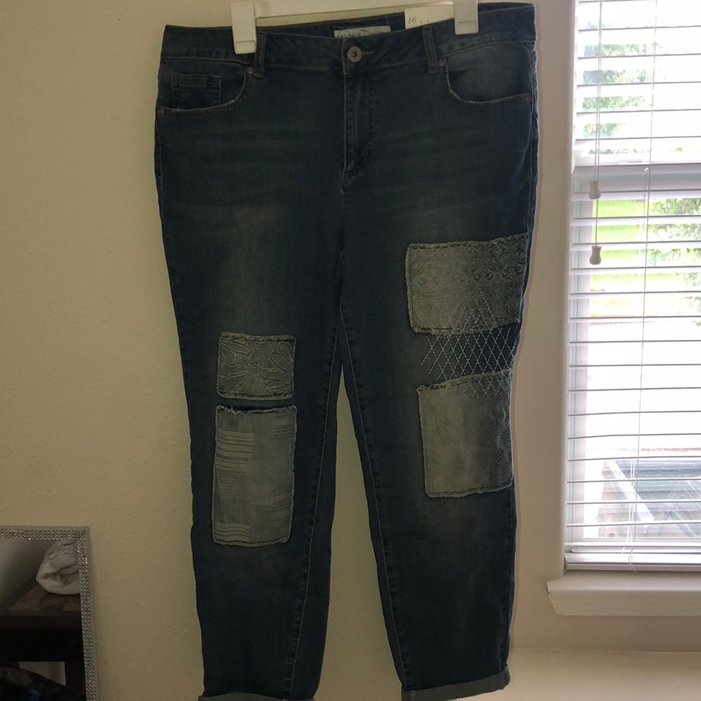 Blue skinny jeans with distressed patches